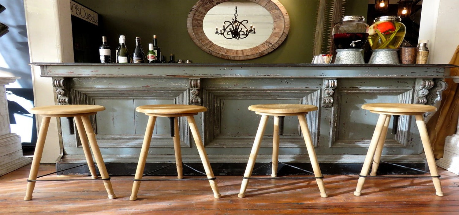 Timber Backless Stool placed on a counter of a home bar.