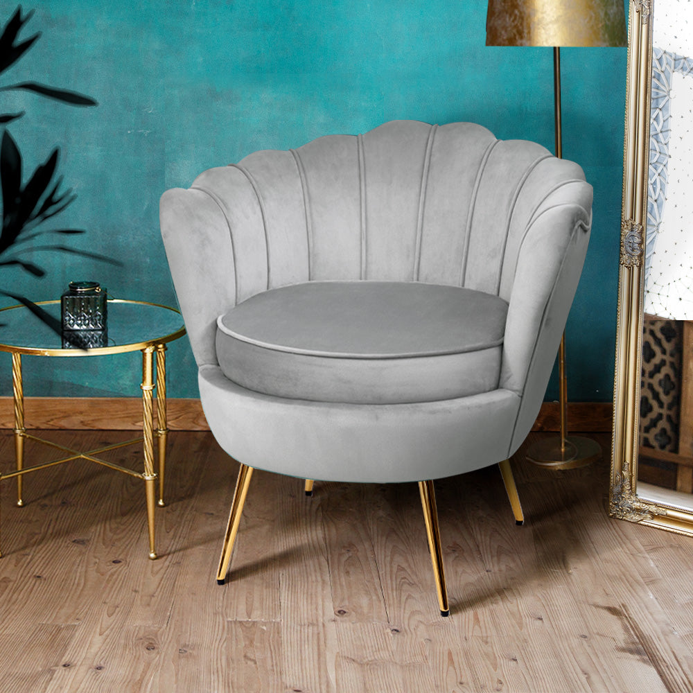 Indulge in luxurious sophistication with our Lotus Flower Shaped Grey Velvet Accent Chair. This exquisite piece adds opulence and charm to any living space, blending timeless design with ultimate comfort. Elevate your home decor with this unique and stylish chair.